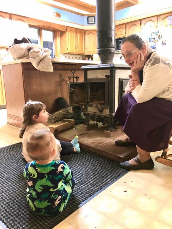 Adi and Elliot soaking up wisdom from Grandma Detweiler while enjoying the warm fireplace at Uncle Ray's house.